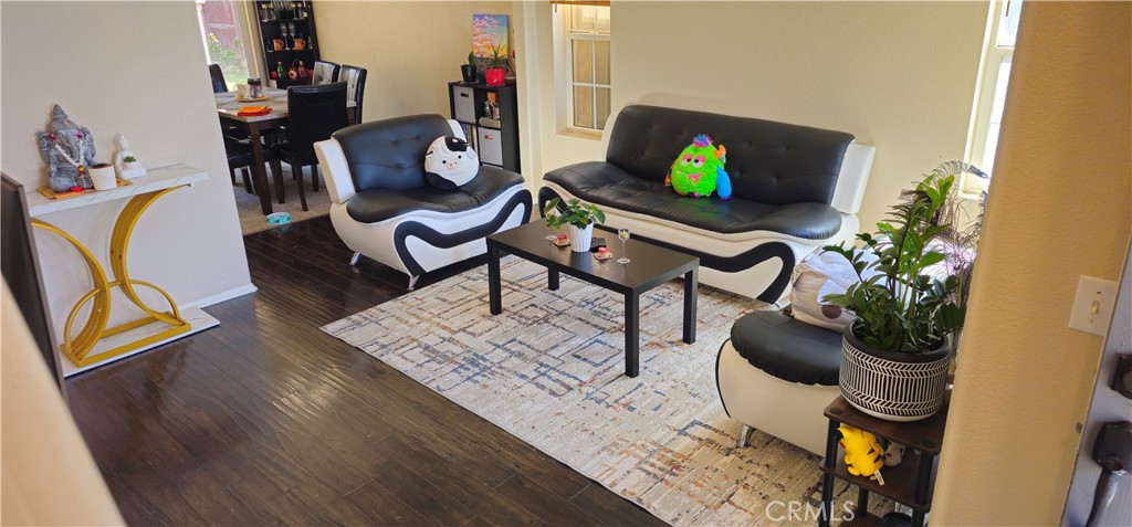 1650 Ravenswood Road Beaumont, CA 92223 - Photo 6 of 42 a living room with furniture and a potted plant