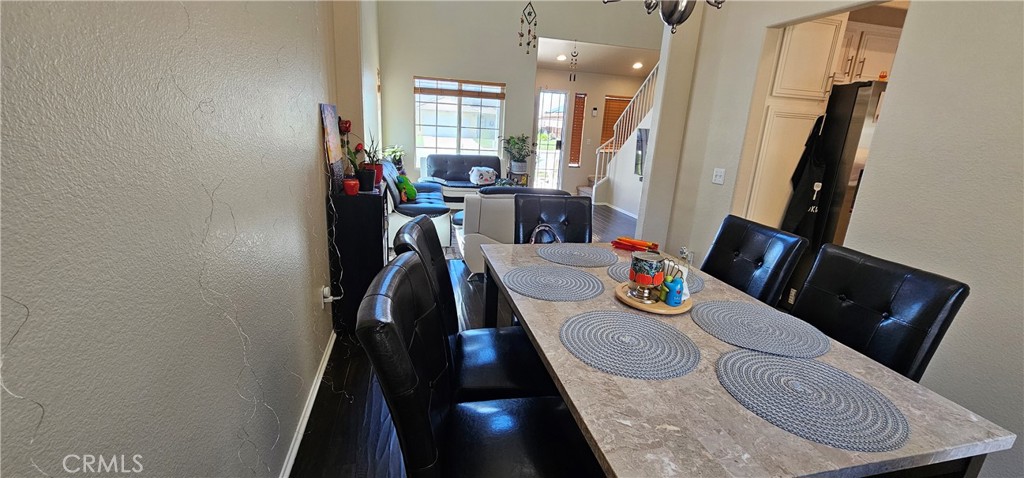 1650 Ravenswood Road Beaumont, CA 92223 - Photo 8 of 42 a view of a dining room with furniture