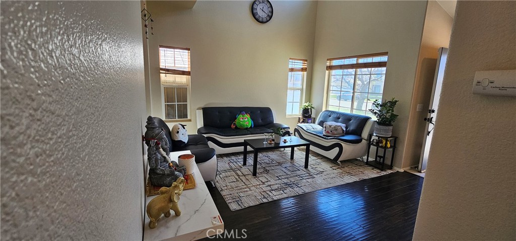 1650 Ravenswood Road Beaumont, CA 92223 - Photo 10 of 42 a living room with furniture and a window