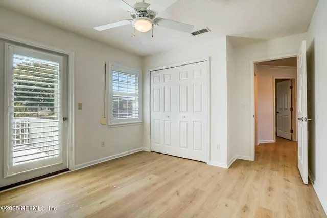 a view of a patio with chair and tables