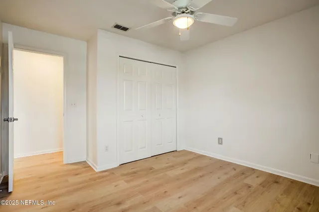 an aerial view of a house with a garden and lake view