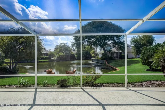 an aerial view of multiple houses with yard