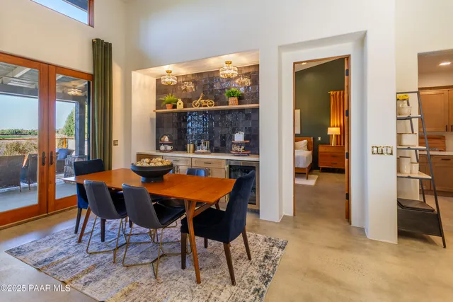 a view of a dining room with furniture window and outside view
