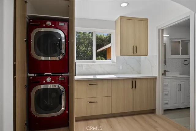 a view of a hallway with washer and dryer