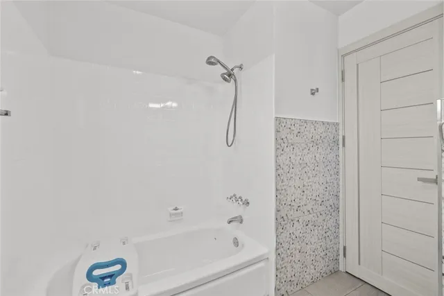 a bathroom with a bath tub