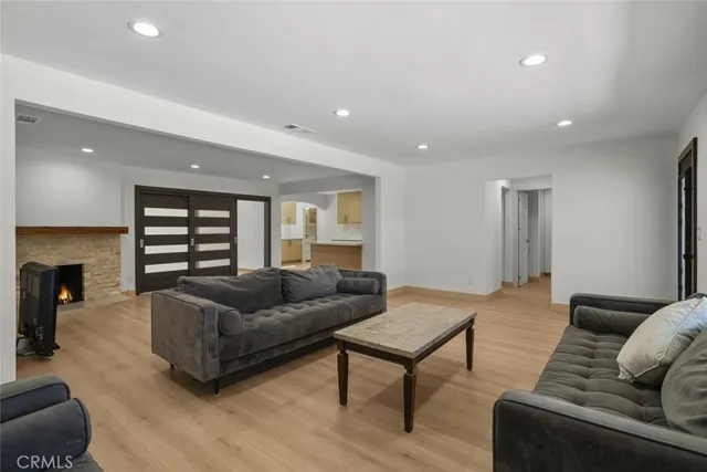 a living room with furniture and a fireplace