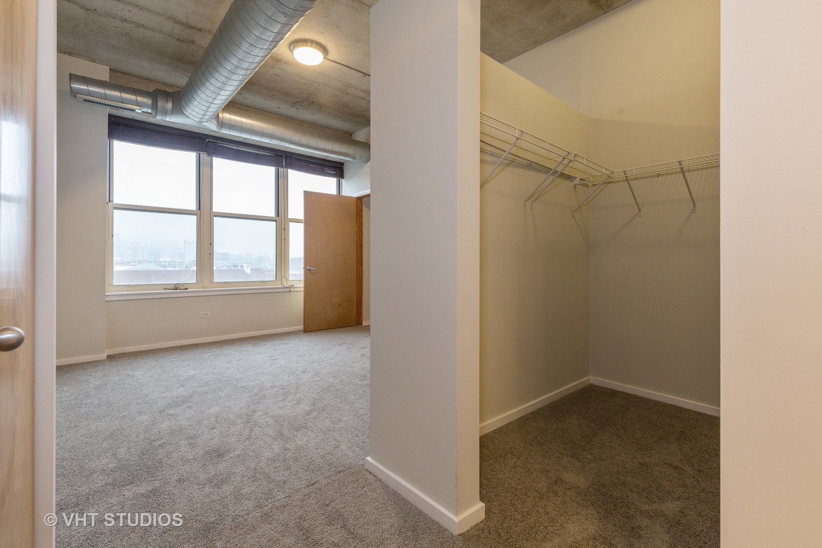 6 South Laflin Street, Unit 807S Chicago, IL 60607 - Photo 12 of 18 an empty room with windows and closet