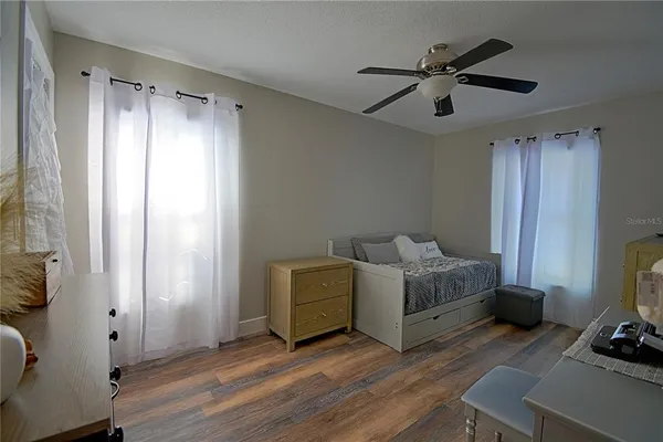 a living room with furniture and a window
