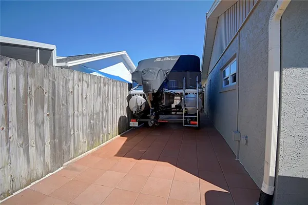 a view of a patio with table and chairs