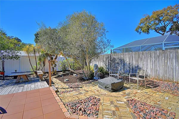 a view of a backyard with sitting area