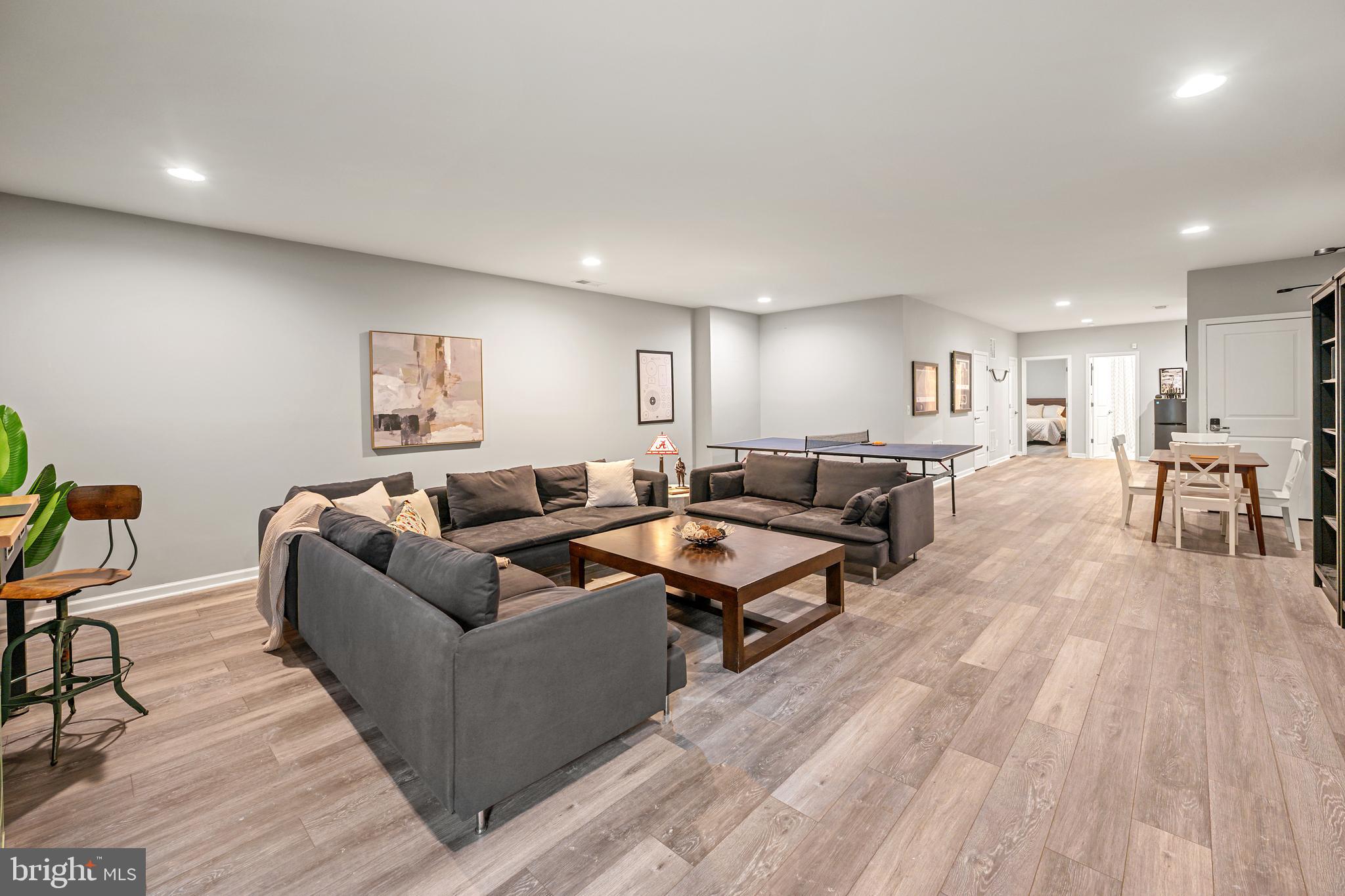 8459 Reformatory Way Lorton, VA 22079 - Photo 47 of 78 a living room with furniture and a wooden floor