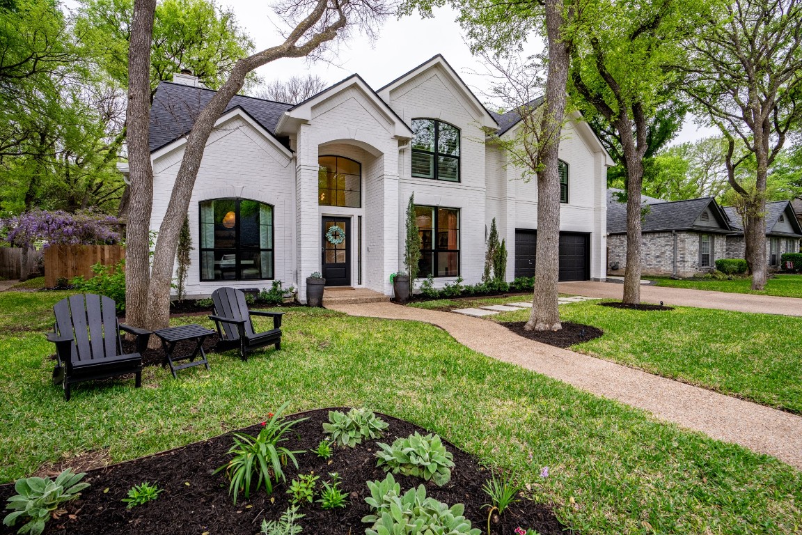 a front view of a house with a yard