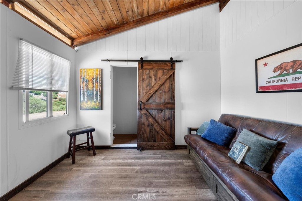 4 Poppy Trail Rolling Hills, CA 90274 - Photo 10 of 13 a living room with furniture and a window