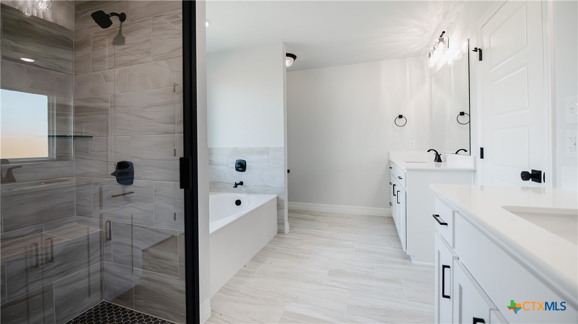 1321 Red Rock Road Lorena, TX 76655 - Photo 14 of 25 a bathroom with a sink a toilet and shower