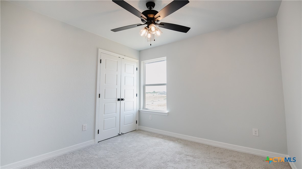 1321 Red Rock Road Lorena, TX 76655 - Photo 19 of 25 wooden floor in an empty room with a window