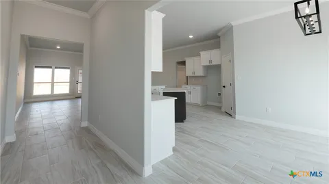 a view of a kitchen cabinets wooden floor and a window
