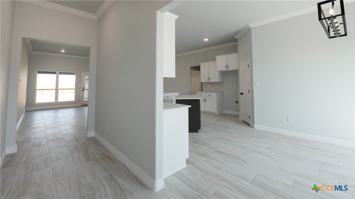 1321 Red Rock Road Lorena, TX 76655 - Photo 3 of 25 a view of a kitchen cabinets wooden floor and a window