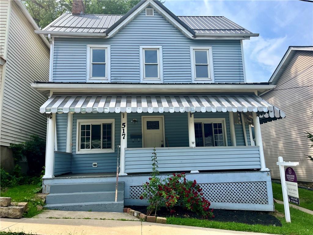 517 North 4th Street Apollo, PA 15613 - Photo 1 of 27 a front view of a house with a garden