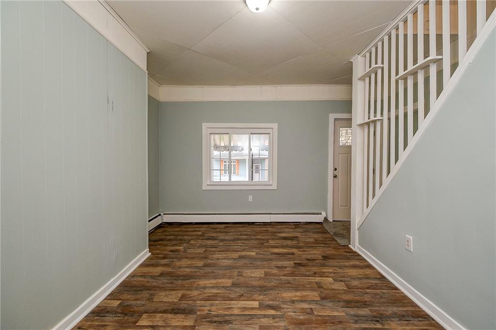 517 North 4th Street Apollo, PA 15613 - Photo 13 of 27 a view of an empty room with wooden floor and a window
