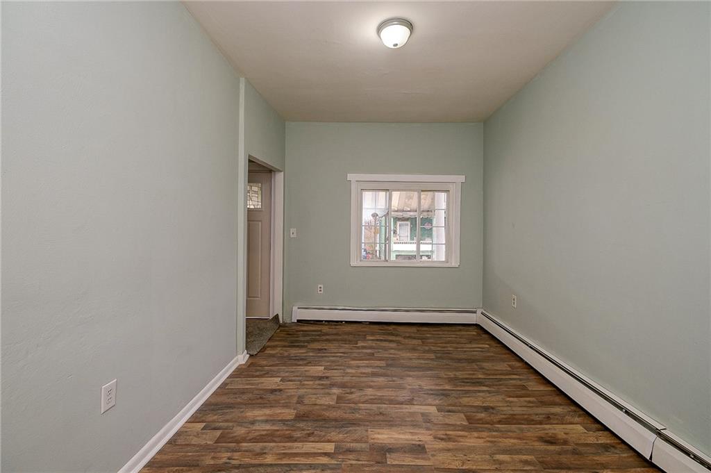 517 North 4th Street Apollo, PA 15613 - Photo 14 of 27 an empty room with wooden floor and windows