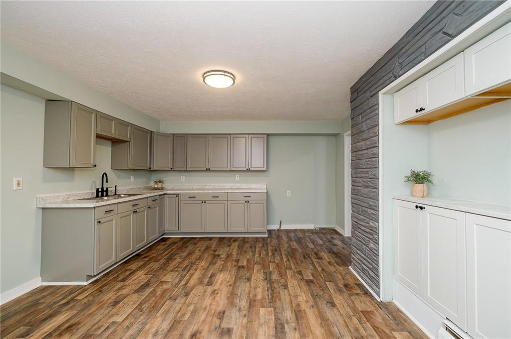 517 North 4th Street Apollo, PA 15613 - Photo 6 of 27 a kitchen with a sink window and stainless steel appliances