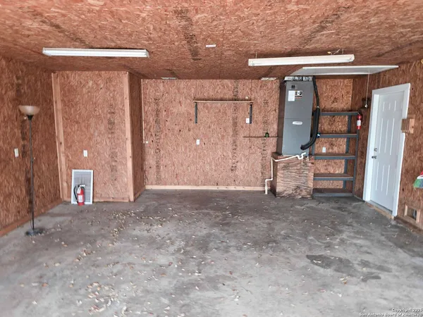 a view of storage and utility room with closet