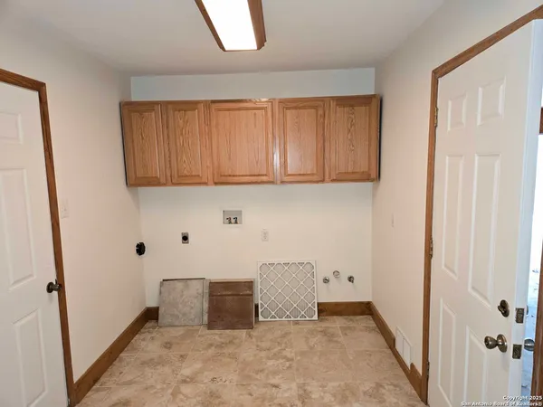 a view of door with wooden floor