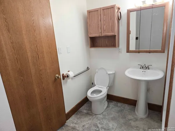 a bathroom with a sink a mirror and a shower