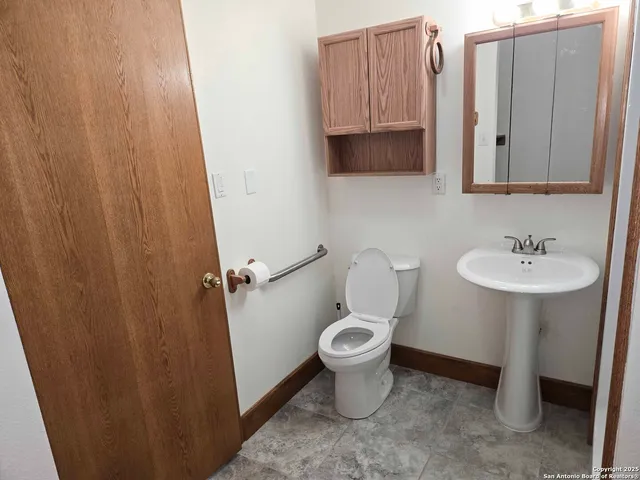 a bathroom with a sink a mirror and a shower