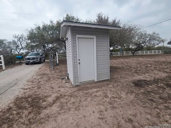 a house with trees in the background