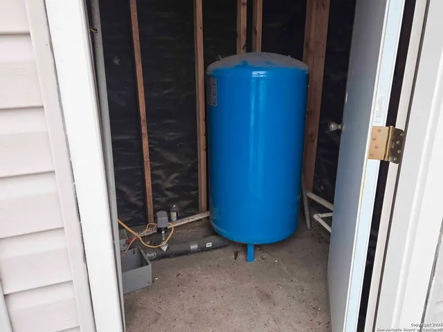 a front view of a house with a garden and trees