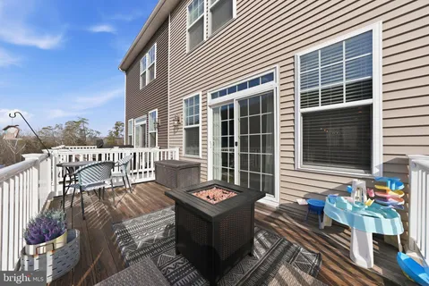 a front view of a house with outdoor seating