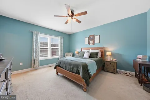 a bed room with a bed and a window