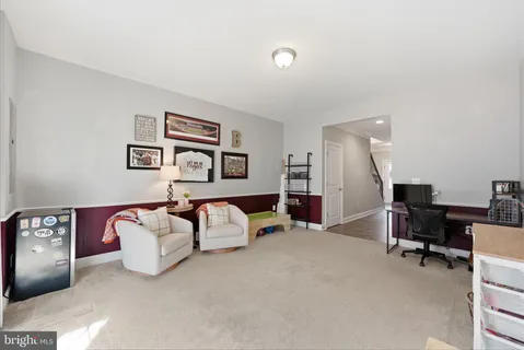 a bedroom with furniture and a lamp