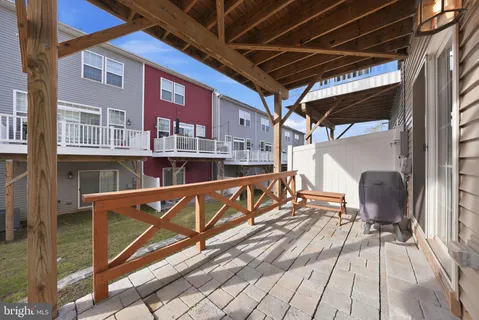 a view of balcony with two chairs and a wooden floor