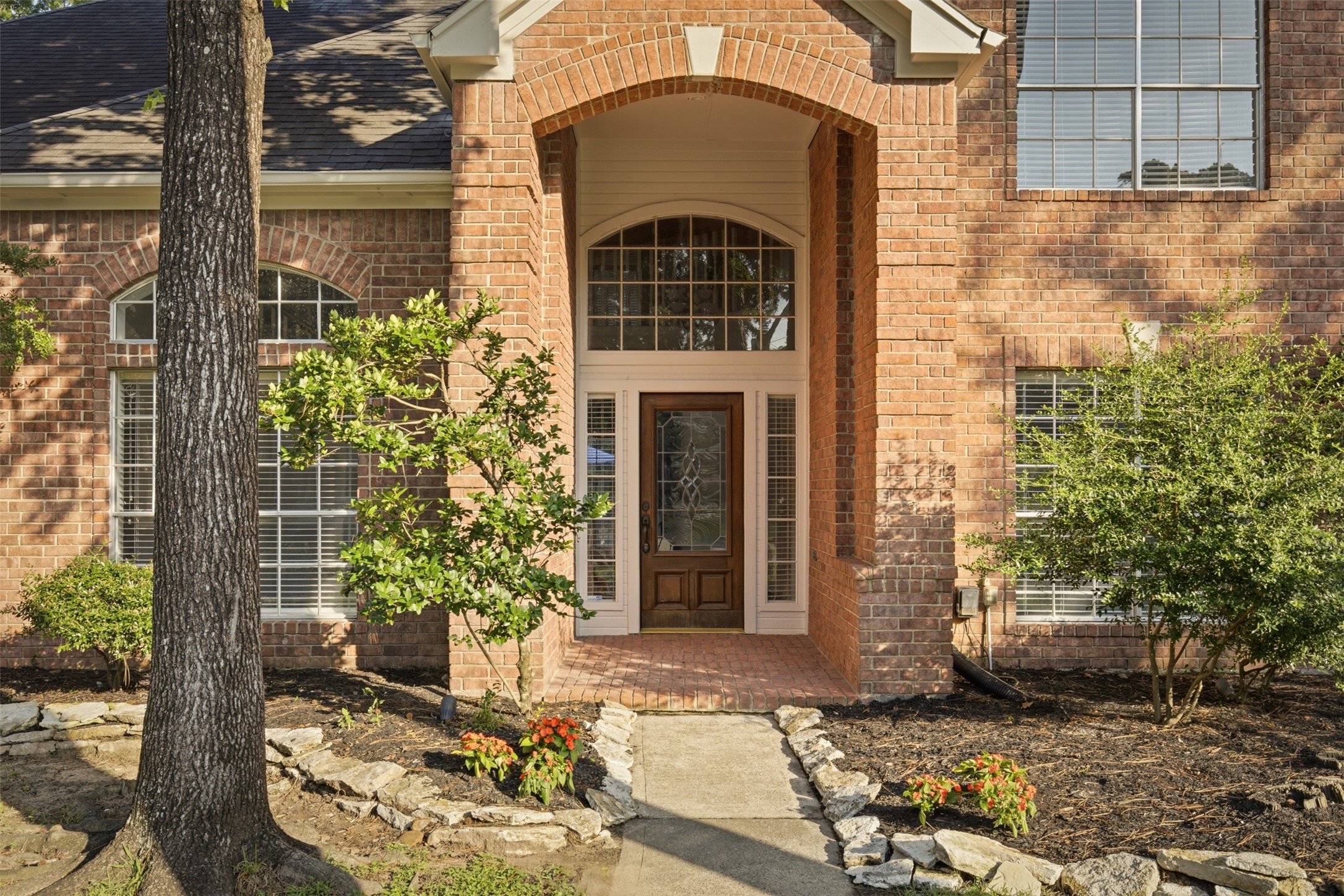 323 Magic Oaks Court Spring, TX 77388 - Photo 3 of 49 Big bright windows and a covered entry will greet you and your guests.