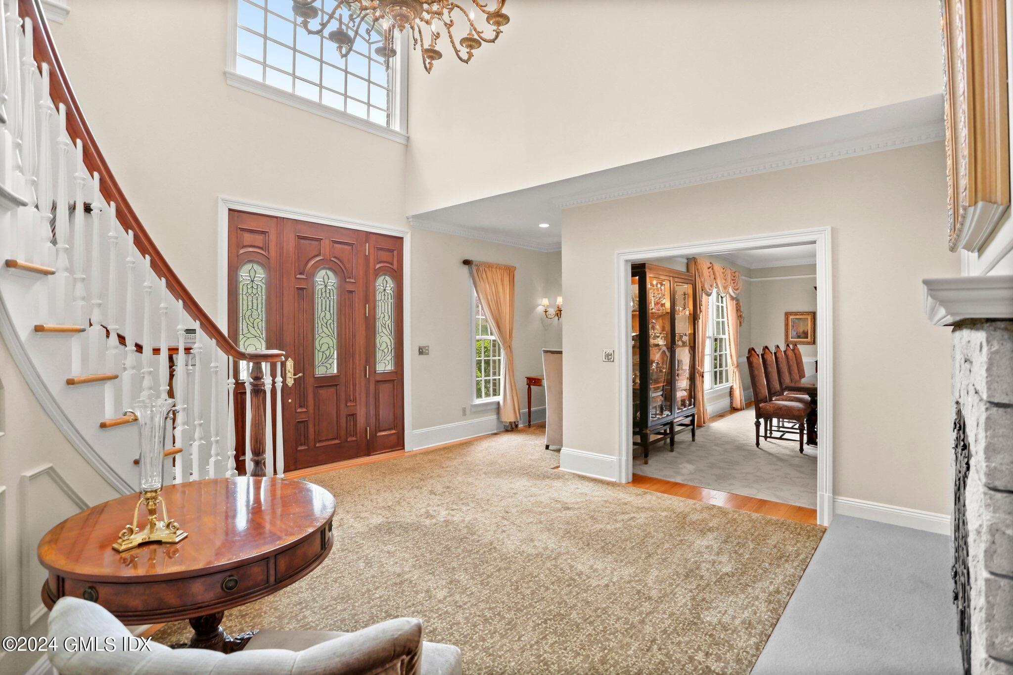 376 Westover Road Stamford, CT 06902 - Photo 6 of 37 a view of a livingroom with wooden floor and a staircase