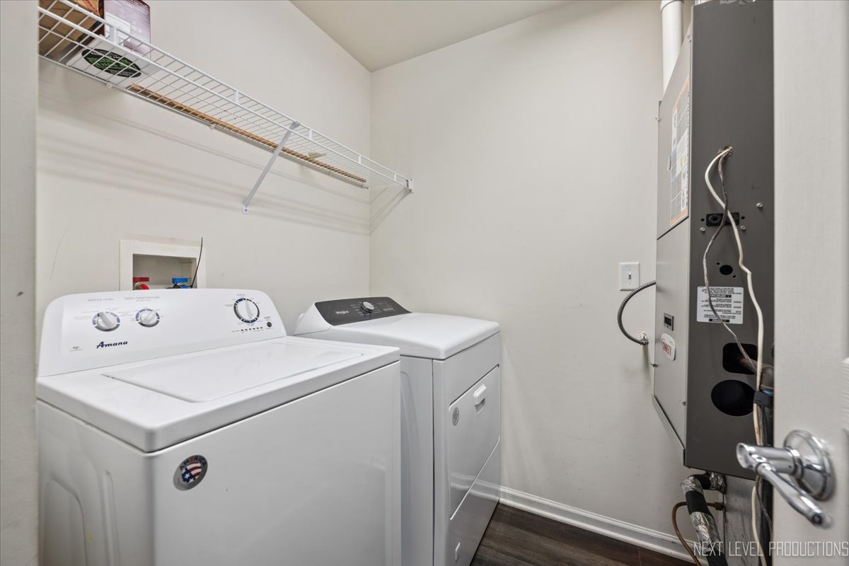 643 Hawley Drive, Unit 643 Oswego, IL 60543 - Photo 16 of 27 a utility room with dryer and washer
