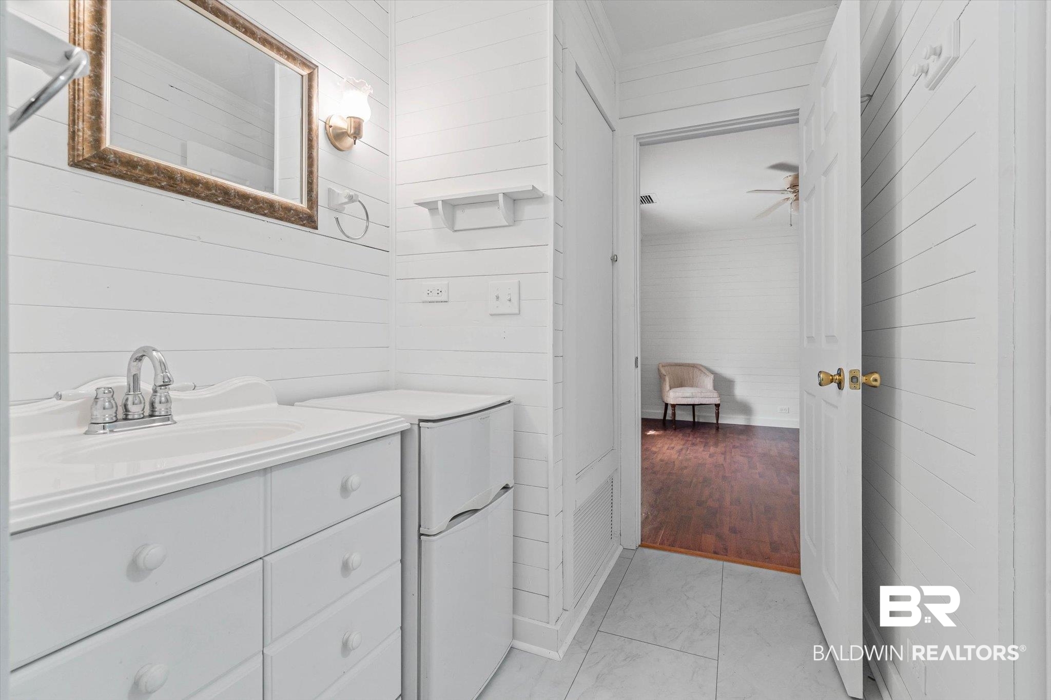 6175 South Grand Bay Wilmer Road Grand Bay, AL 36541 - Photo 25 of 42 Bathroom with wood walls, vanity, and light tile patterned floors