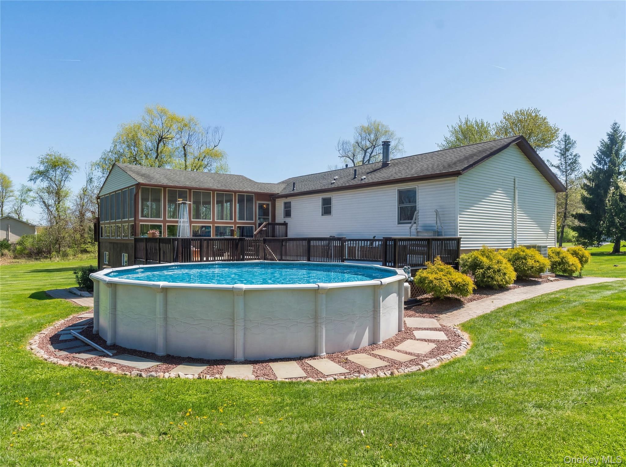 3 Duby Road Wallkill, NY 12589 - Photo 7 of 40 Expansive backyard featuring an above-ground pool with surrounding paver and stone border