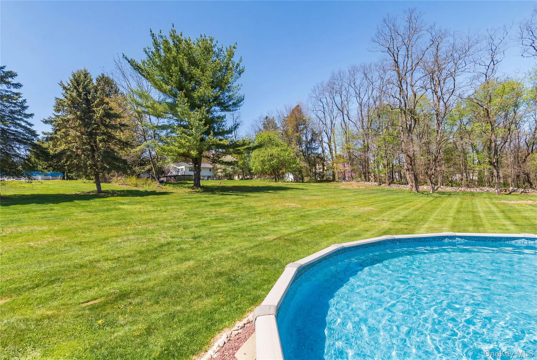 3 Duby Road Wallkill, NY 12589 - Photo 8 of 40 Above-ground swimming pool with a vibrant blue interior