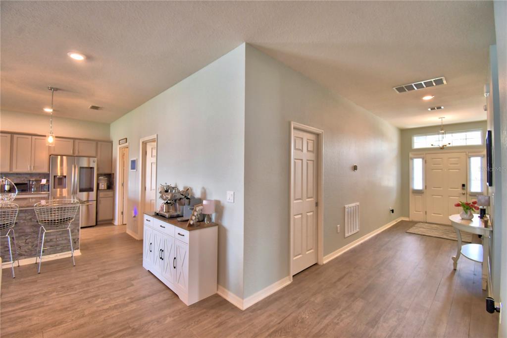 4340 Reding Way Lakeland, FL 33813 - Photo 10 of 63 a kitchen with stainless steel appliances kitchen island granite countertop a refrigerator and a sink