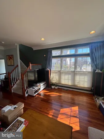 a room with furniture pool table and windows