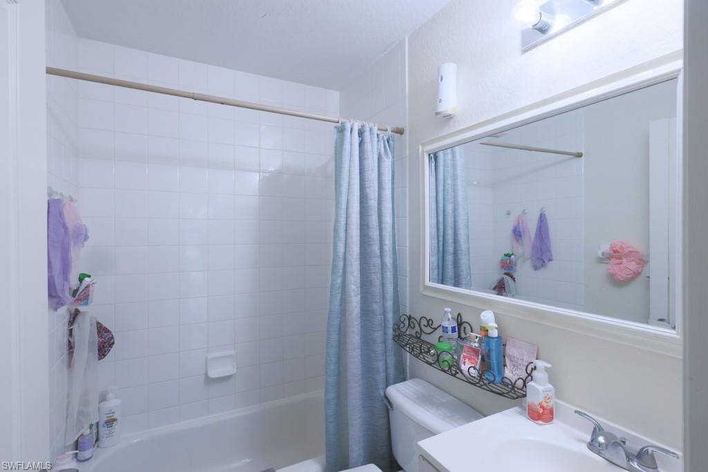 2300 Hunter Boulevard Naples, FL 34116 - Photo 13 of 16 a bathroom with a sink toilet and shower