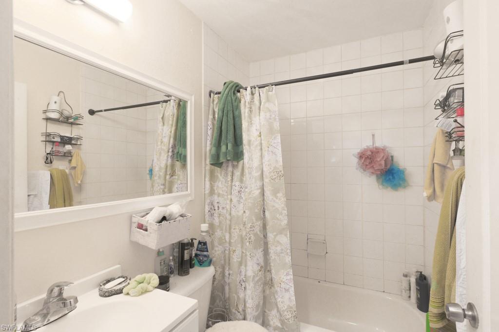 2300 Hunter Boulevard Naples, FL 34116 - Photo 6 of 16 a bathroom with a shower and a sink