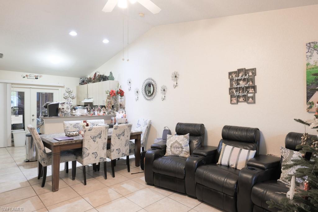 2300 Hunter Boulevard Naples, FL 34116 - Photo 9 of 16 a living room with furniture and a dining table