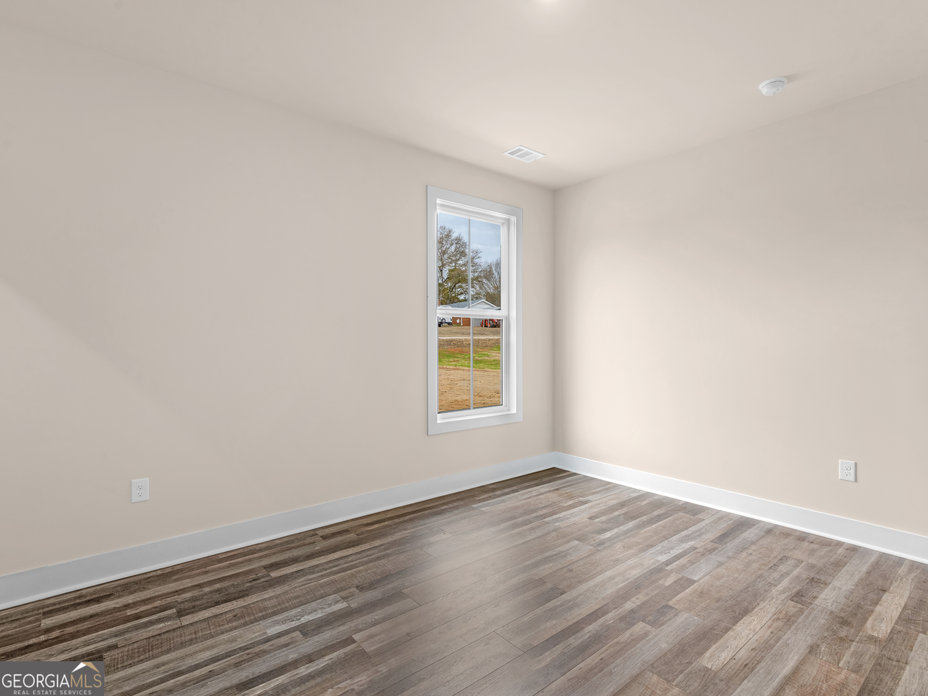 160 Loyd Road Mansfield, GA 30056 - Photo 40 of 53 a view of an empty room with wooden floor and a window