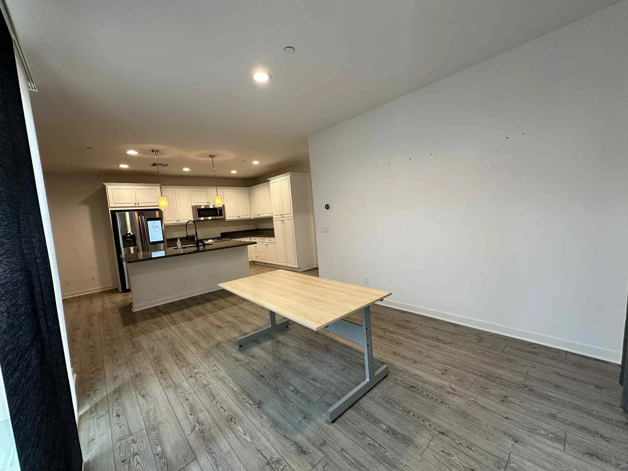 1958 P.º Lugo Chula Vista, CA 91913 - Photo 13 of 68 a view of kitchen with cabinets and wooden floor