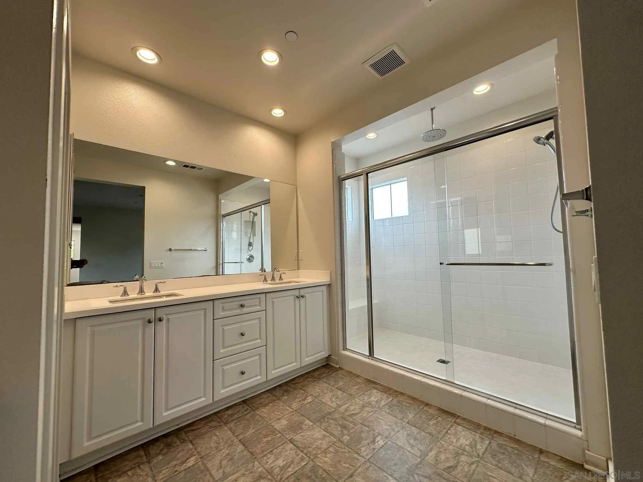1958 P.º Lugo Chula Vista, CA 91913 - Photo 51 of 68 a bathroom with a granite countertop sink mirror and shower