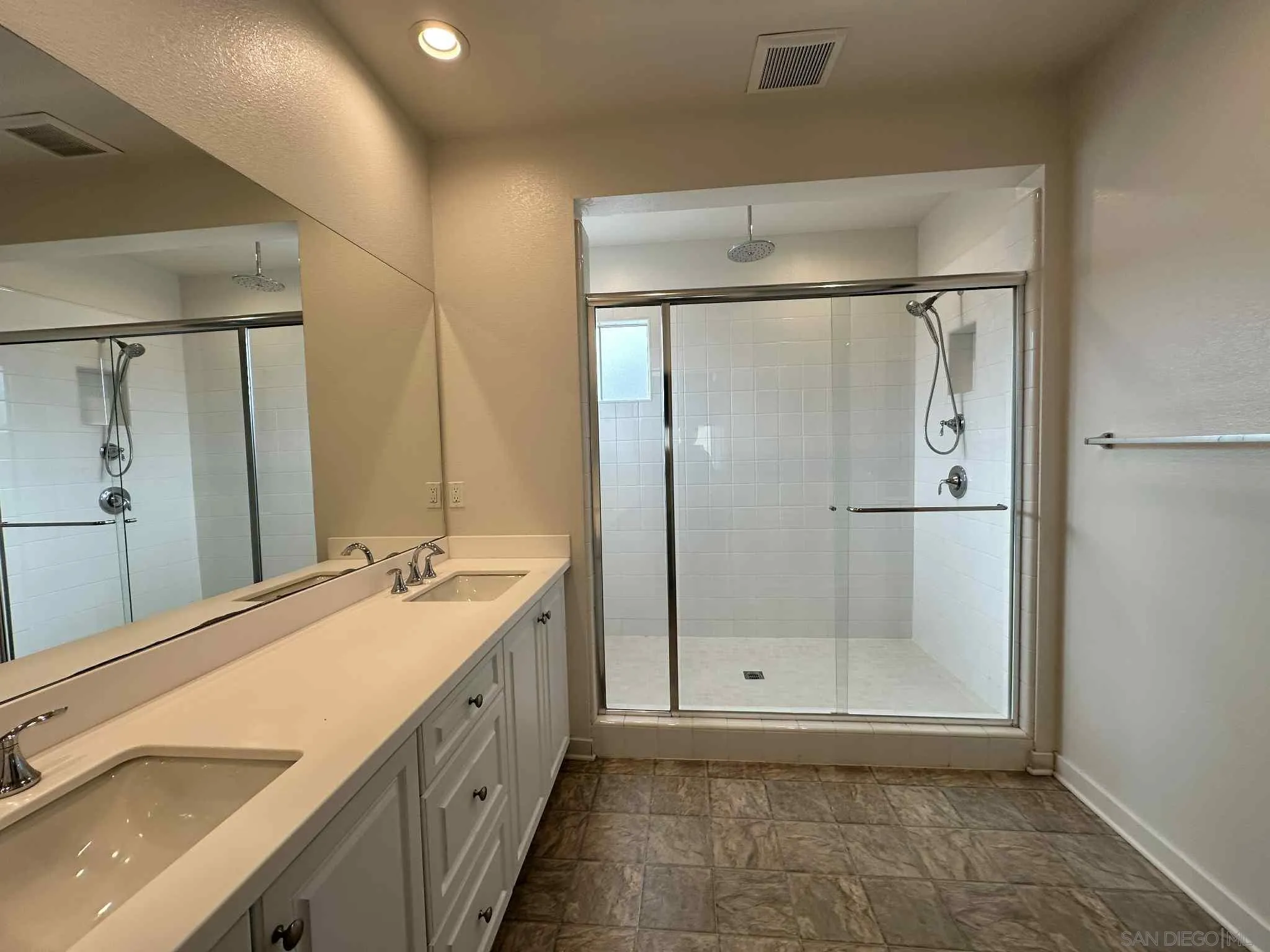 1958 P.º Lugo Chula Vista, CA 91913 - Photo 58 of 68 a bathroom with a double vanity sink mirror and double